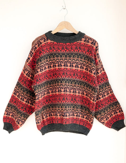 Pull rouge motif géométrique