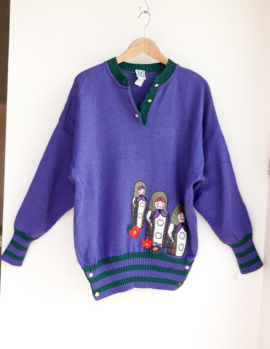 Pull violet poupées russes